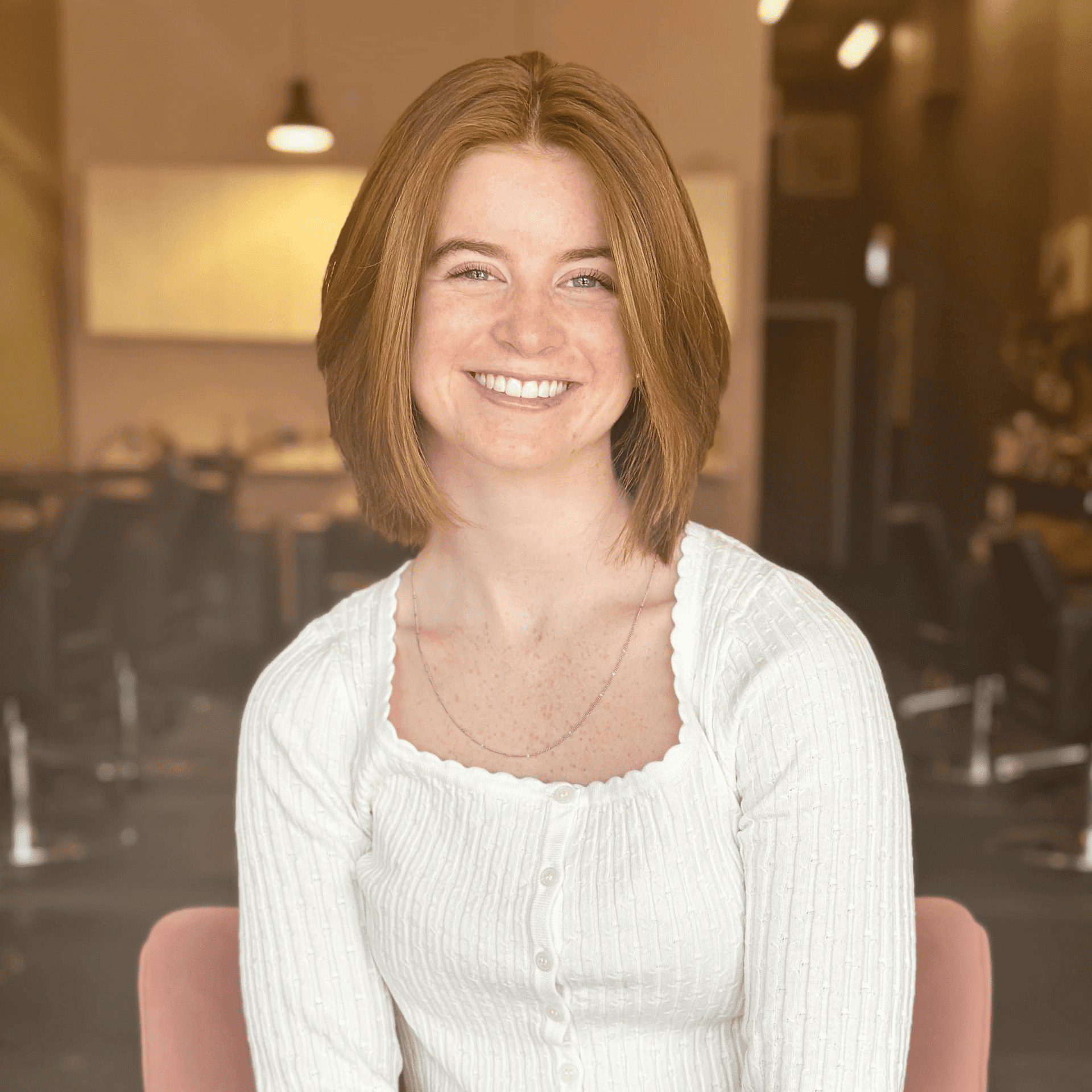 Portrait of Juliana Grace, a professional stylist at Isaac Crawford Salon, showcasing their expertise and style.