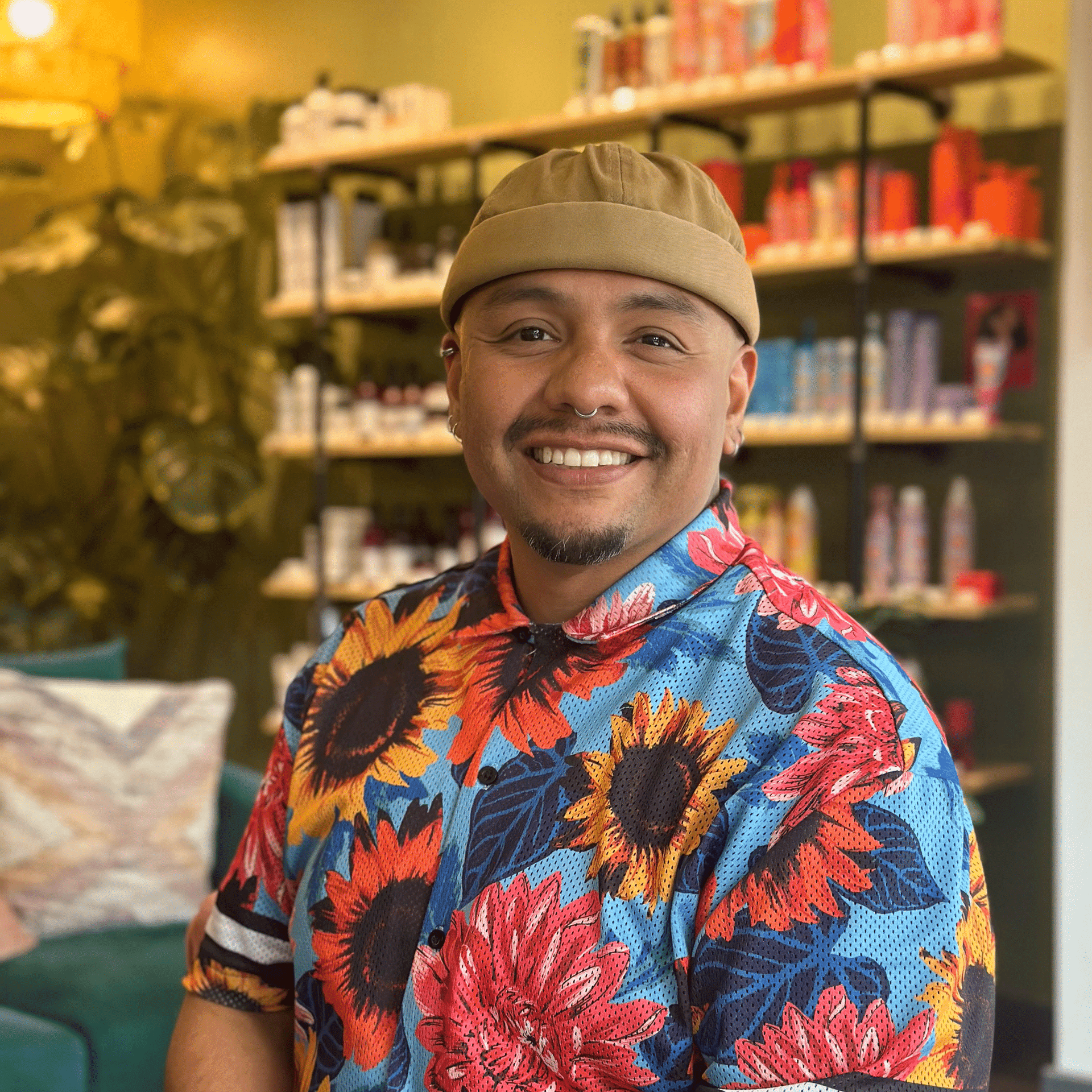 Portrait of Danji Godoy, a professional stylist at Isaac Crawford Salon, showcasing their expertise and style.