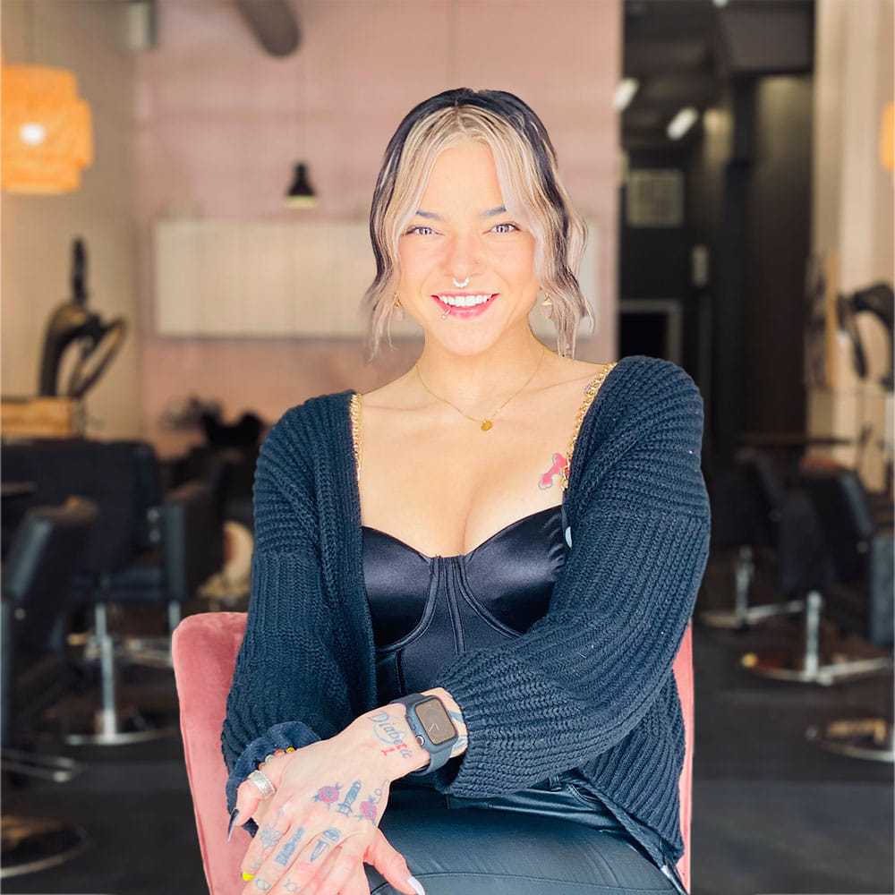 Portrait of Olyvia Diaz, a professional stylist at Isaac Crawford Salon, showcasing their expertise and style.
