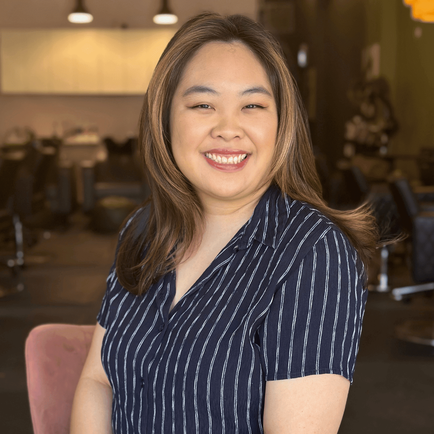 Portrait of Lauren Paclar, a professional stylist at Isaac Crawford Salon, showcasing their expertise and style.