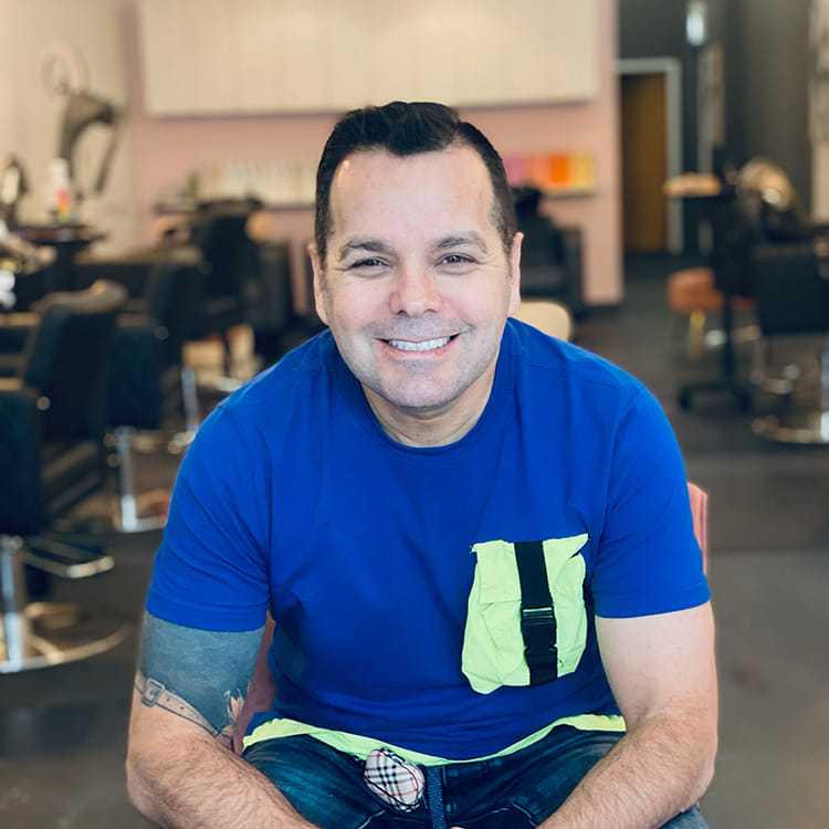 Portrait of Jorge Diaz, a professional stylist at Isaac Crawford Salon, showcasing their expertise and style.